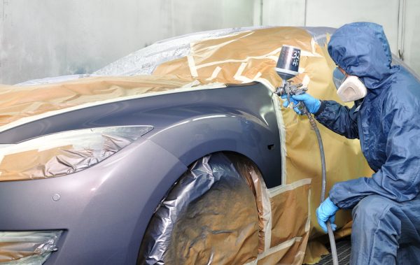 Guy Air Brushing a silver car The Auto Paint Depot